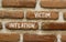 Inflation victim symbol. Concept words Inflation victim on red brown brick wall. Beautiful red brown brick wall background.