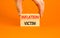 Inflation victim symbol. Concept words Inflation victim on wooden block. Beautiful orange table orange background. Businessman