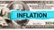 Inflation World economics and inflation control concept. Torn bills revealing Inflation words. Idea for FED consider