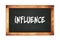 INFLUENCE text written on wooden frame school blackboard