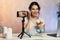 Influencer Young girl blogger talks about skincare. Woman recording video blog tells how to be beautiful. Bloger talks facial
