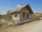 Info center stone house of `The eyes of god` cave or `Prohodna` cave near Karlukovo village, Bulgaria.