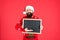 Information from Santa. Bearded man hold blank blackboard. Santa point at information board. Information for New Year