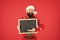 Information from Santa. Bearded man hold blank blackboard. Santa point at information board. Information for New Year