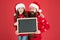 Information for Santa. Happy family hold information board. Festive New Year information. Holiday commercial. Christmas