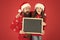 Information for Santa. Happy family hold information board. Festive New Year information. Holiday commercial. Christmas