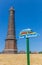 Information sign and lighthouse in the center of Borkum