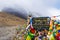 Information sign and prayer flags on Thorang-la pass, Annapurna Conservation Area, Nepal