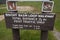 Information trailhead sign for Biscuit Basin Loop walkway with the Mystic Falls waterfall trail nearby