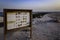 Informational signboard on a beach. Al Karaana Lagoon, Doha, Qatar.