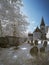 Infrared landscape of old church in churchyard in English countr