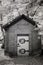 Infrared Photo of a Small Brick Building at a Cemetery