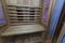 Infrared sauna interior close up view. Wooden walls and bench, ceramic heaters.