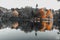 Infrared shot of trees on the tranquil shore of a lake, creating an idyllic nature scene