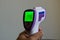 Infrared thermometer held in hand