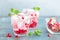 Infused water made of fresh pomegranate and mineral water with ice