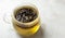 Infusing herbal tea in glass mug on marble table