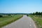 Ingen, Gelderland, the Netherlands - Cyclists driving the dyke of the river Rhine