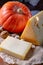 Ingrediens for traditional seasonal Swiss dish, pumpkin fondue with gruyer and emmentaler cheeses, fresh creme and nutmeg