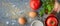 Ingredients for baked eggs with tomatoes on the stone table wide screen