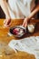 Ingredients for baking cake stuffed with fresh cherry pie. Female preparing cherry pie. Rustic dark style. See series recipe step