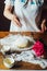 Ingredients for baking cake stuffed with fresh cherry pie. Female preparing cherry pie. Rustic dark style. See series recipe step