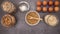 Ingredients for baking and organic bun and healthy bagels appear on kitchen table - Stop motion