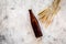 Ingredients for beer. Malting barley near beer glasses and bottle on grey background top view copyspace