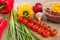 Ingredients for Burritos, vegetables, corn, tomatoes and peppers on wooden background. Top view