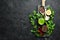 Ingredients for chimichurri sauce: fresh parsley, onion, garlic, olive oil, lemon. On a black background. Top view.