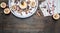 Ingredients for cooking apples with honey and nuts, cinnamon and seasonings, sliced apples with filling on a rustic wooden backgr