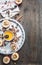 Ingredients for cooking apples with honey and nuts, cinnamon and seasonings, sliced apples with filling on a rustic wooden backgro