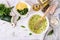 Ingredients for cooking frittata with zucchini, cheese and basil.