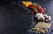 Ingredients for cooking pasta on a black background