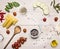 Ingredients for cooking pasta cannelloni, cherry tomatoes, zucchini and pepper unground wooden rustic background top view