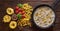 Ingredients for cooking pasta with creamy sauce. Dry pasta, on a dark wooden table.