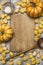 Ingredients for cooking pumpkin gnocchi flour sieve flour wooden spoon almonds pumpkin, wooden cutting board wooden rustic bac