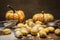 Ingredients for cooking pumpkin gnocchi flour sieve flour wooden spoon pumpkin, wooden cutting board on wooden rustic background