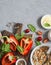 Ingredients for cooking quinoa stuffed bell peppers. Top view, flat lay.