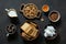 Ingredients for cooking vegetarian chocolate salami on dark background.