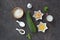 Ingredients for cooking zucchini wafers on a dark concrete background