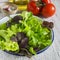 Ingredients for fresh vegetable salad - tomatoes, garden herbs