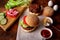 Ingredients for hamburger, cheeseburger. Wooden background. Home cooking hamburger. Food concept. Hamburger day