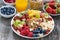 Ingredients for a healthy breakfast - berries, fruit and muesli