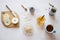 Ingredients for healthy breakfast. Chia seeds, oatmeal cereals and apple on white table. Flatlay