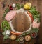 Ingredients for making fresh turkey, vegetable, herbs, spices ,fruit lined circle on wooden rustic background top view