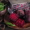 Ingredients for making healthy vegan food with chopped beetroot and spinach in clay plates