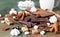 Ingredients for making hot chocolate. Dark and milk chocolate, cocoa powder, cinnamon, anise star, brown sugar, marshmallow,