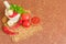 Ingredients for making ketchup. Tomatoes, chili peppers and spices on a brown background. Top view. Copy space.