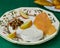 Ingredients for making Tasty Mixed Spanish Empanadillas and empanadillas on a dish on a tablecloth